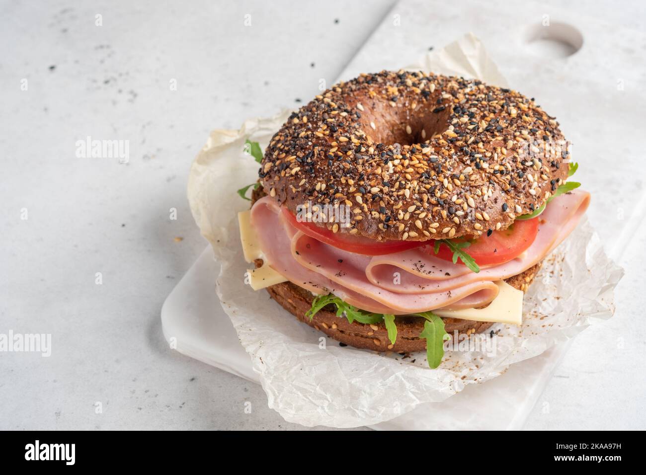 bagel filled with ham, cream cheese and tomato Stock Photo Alamy