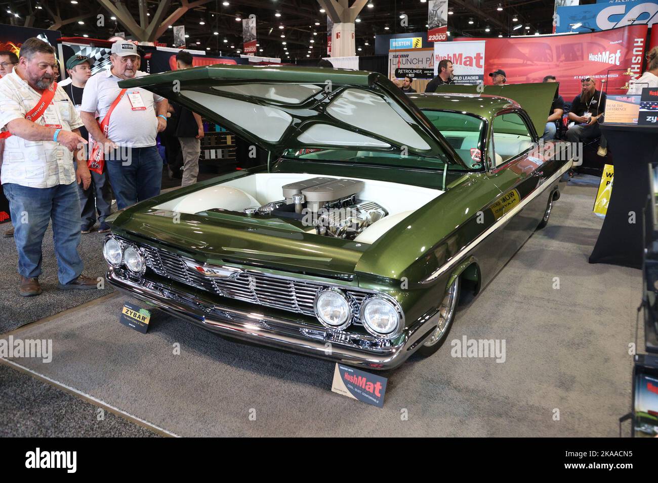 Las Vegas, United States. 01st Nov, 2022. Attendees view the engine of the 'Dirty Martini', a customized 1961 Chevrolet Impala on display during the 2022 SEMA Show, at the Las Vegas Convention center in Las Vegas, Nevada, Tuesday, November 1, 2022. The Specialty Equipment Market Association (SEMA), sometimes referred to as the SEMA Car Show 2022, brings together manufacturers and buyers in every segment of the automotive industry, Photo by James Atoa/UPI Credit: UPI/Alamy Live News Stock Photo