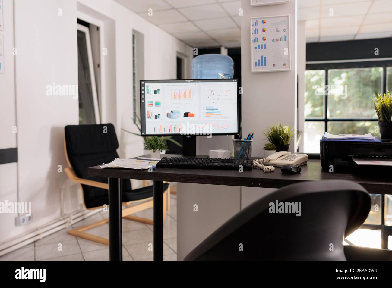 Empty office at the beginning of the day with growth statistics