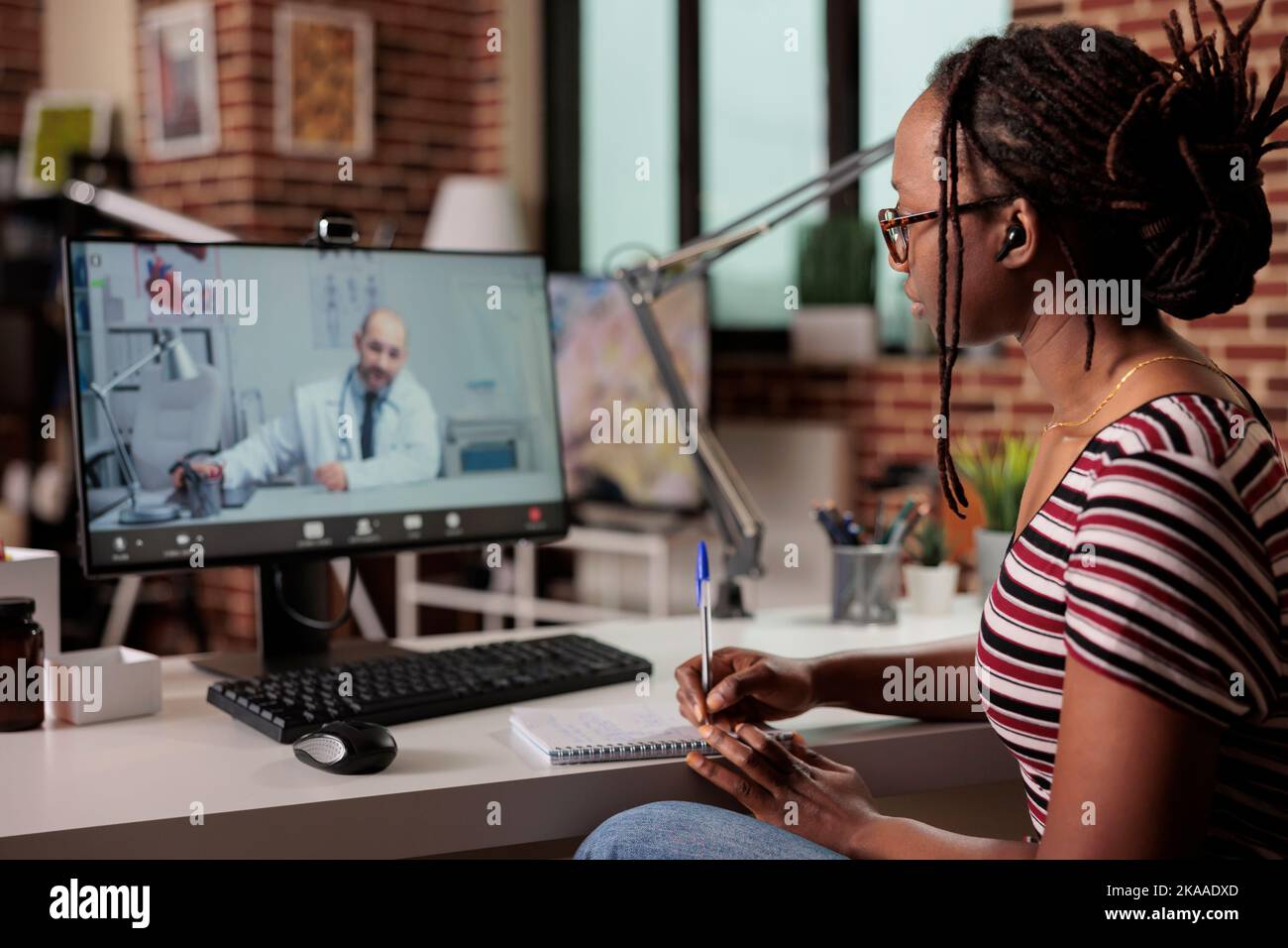 Doctor taking video appointment hi-res stock photography and images - Alamy