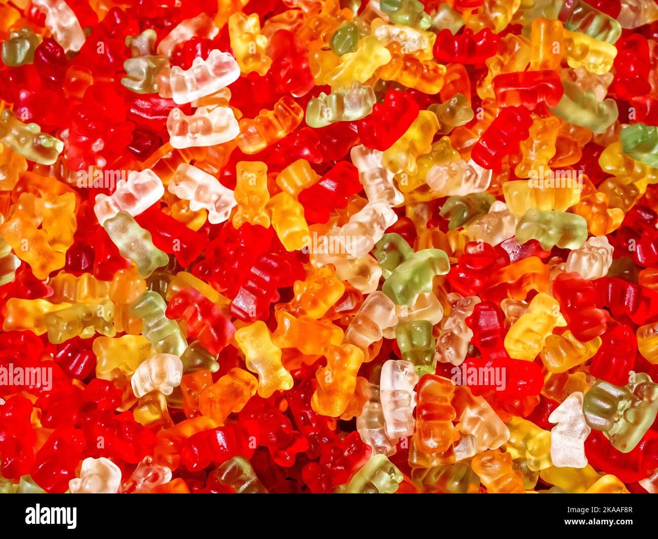 Colorful gummy bears. Top view, flat lay. Background of delicious candies. Stock Photo