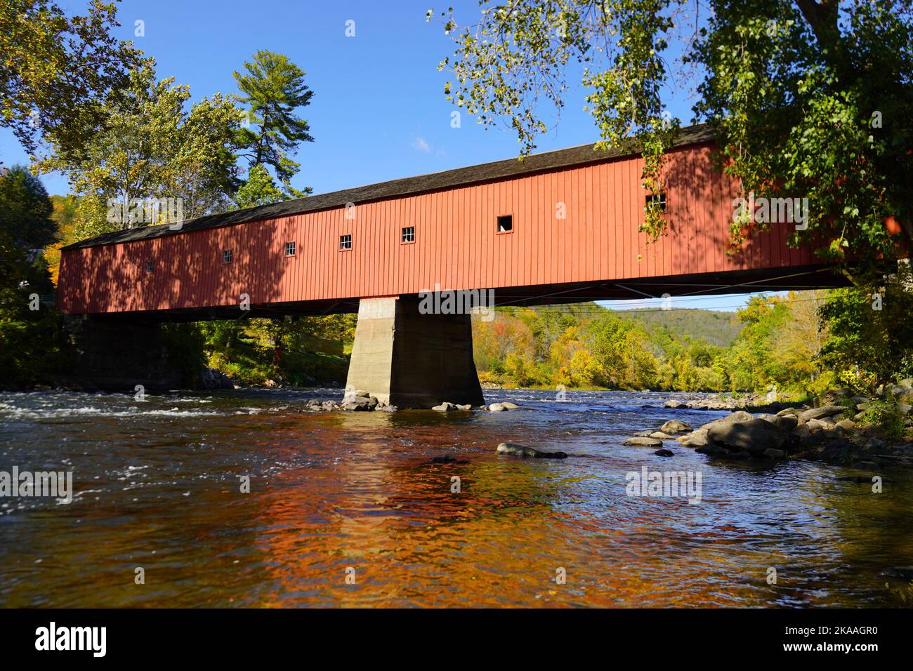 West Cornwall covered bridge over the Housatonic River in Autumn Stock