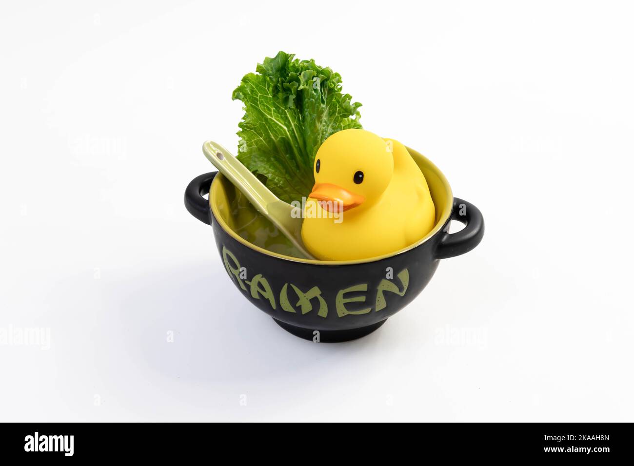 suggestive to the phenomenon of veganism, where a toy duckling represents the food alternatives that supply animal meat, Stock Photo