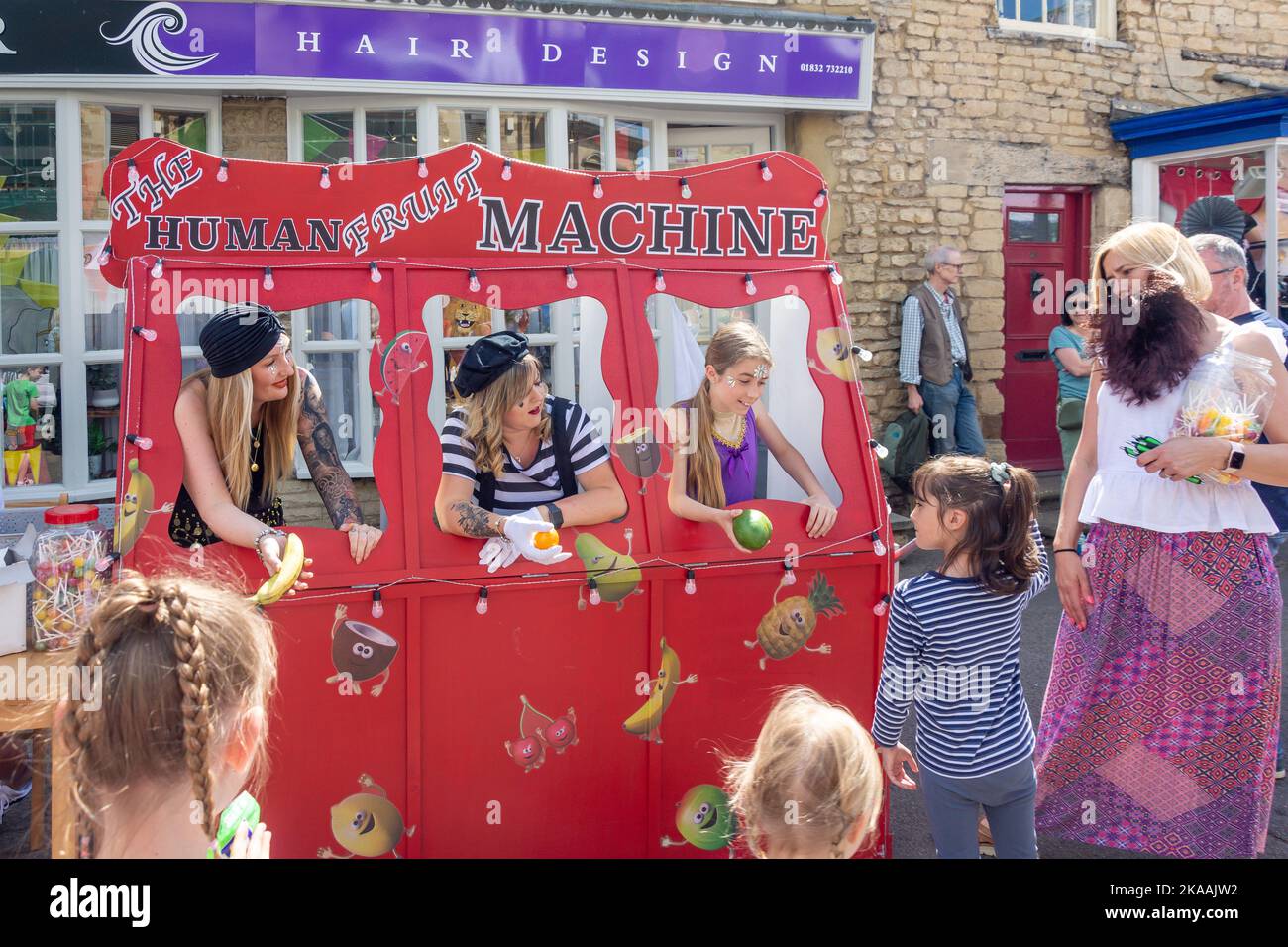 The Human Fruit Machine at Circus Chater Fair, High Street, Thrapston, Northamptonshire, England, United Kingdom Stock Photo