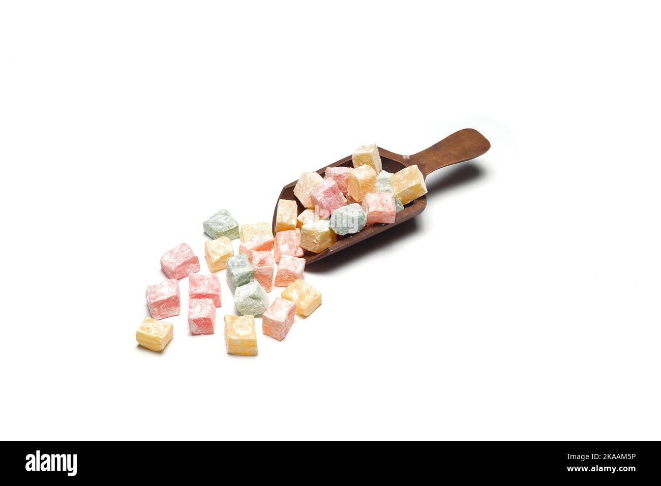 Colorful Turkish Delights in a wooden scoop. isolated on white ...
