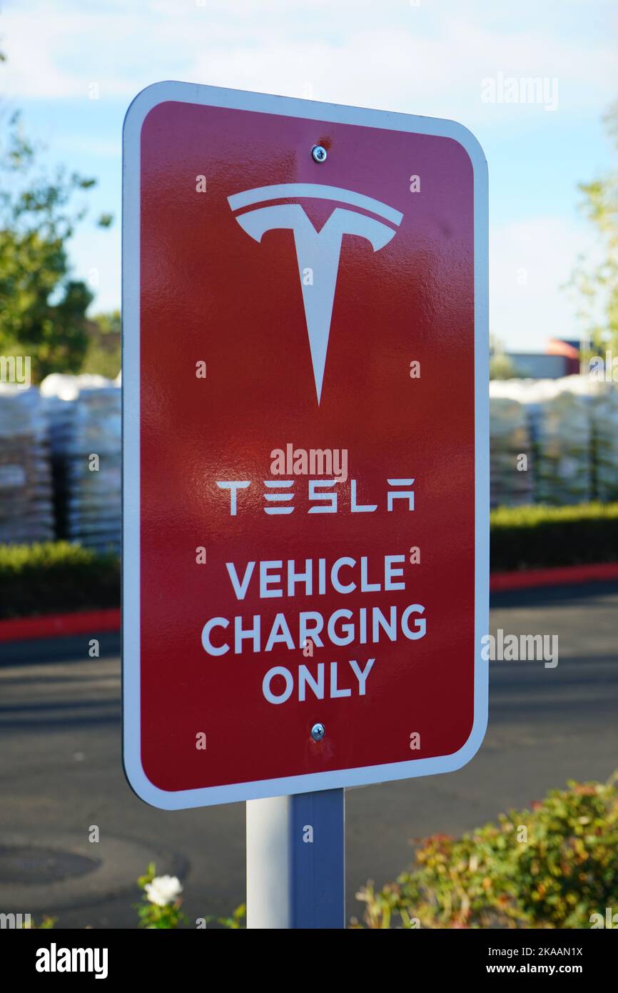 Menifee, CA, USA - October 31, 2022: A Tesla vehicle only charging sign at a recharging station. Stock Photo