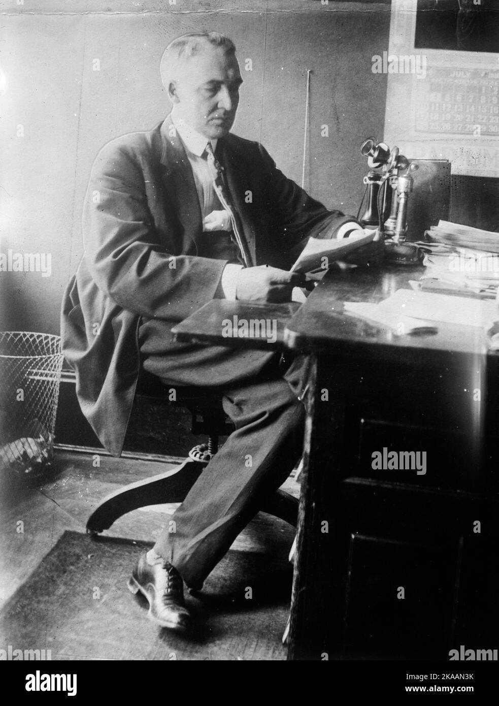 US President Warren Harding seated at his desk in the White House Stock Photo