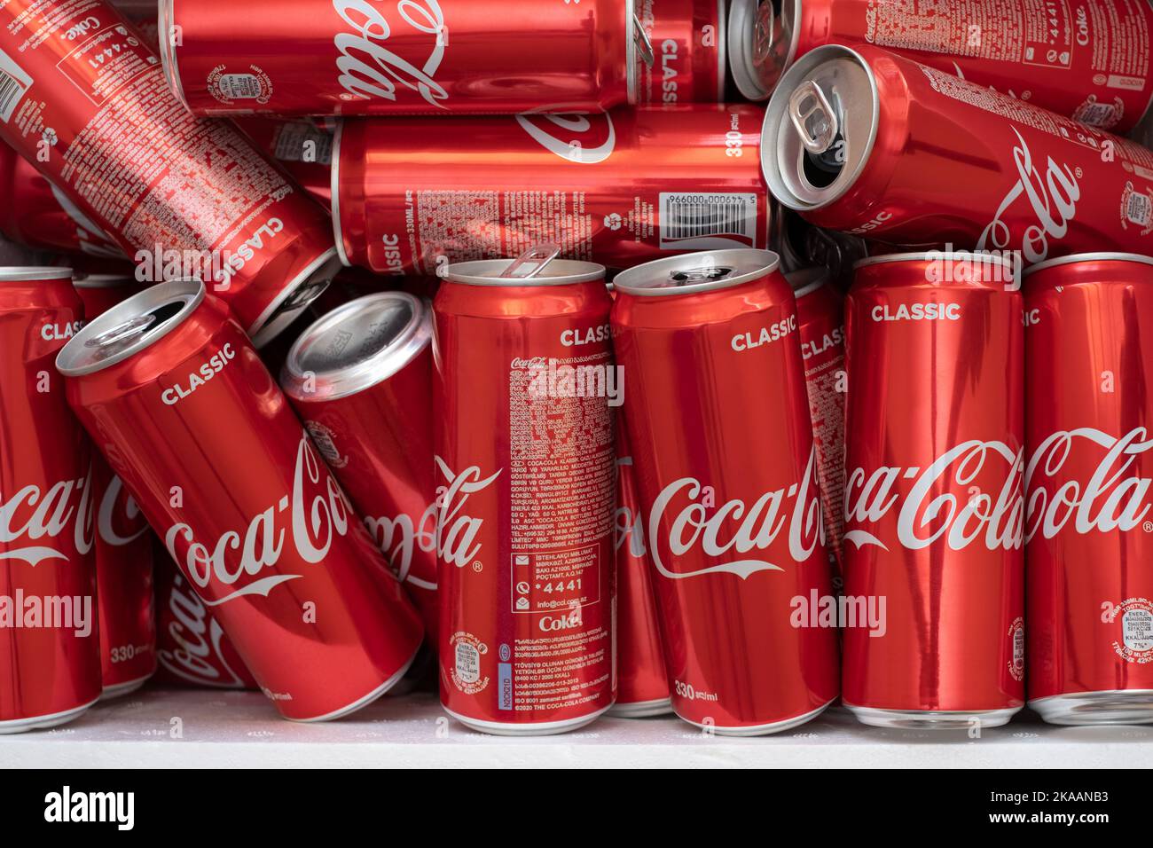 Israel - 31 may 2022: Heap of aluminum Coca-Cola cans in trash for recycling waste. Sugar in drink. Editorial Stock Photo