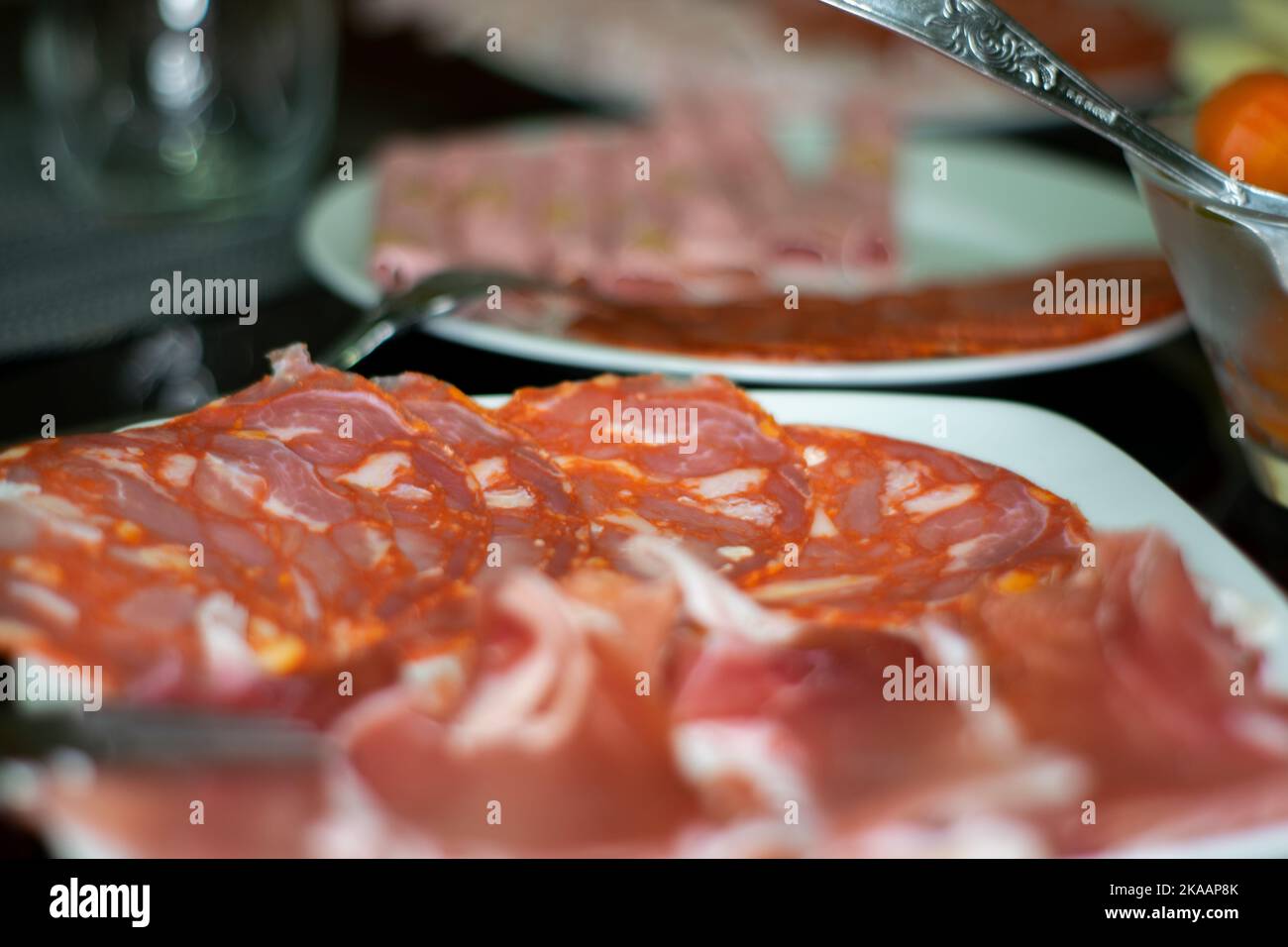 Tapas food, raclette and smoked ham and chorizo. Portuguese food and flavors. Stock Photo