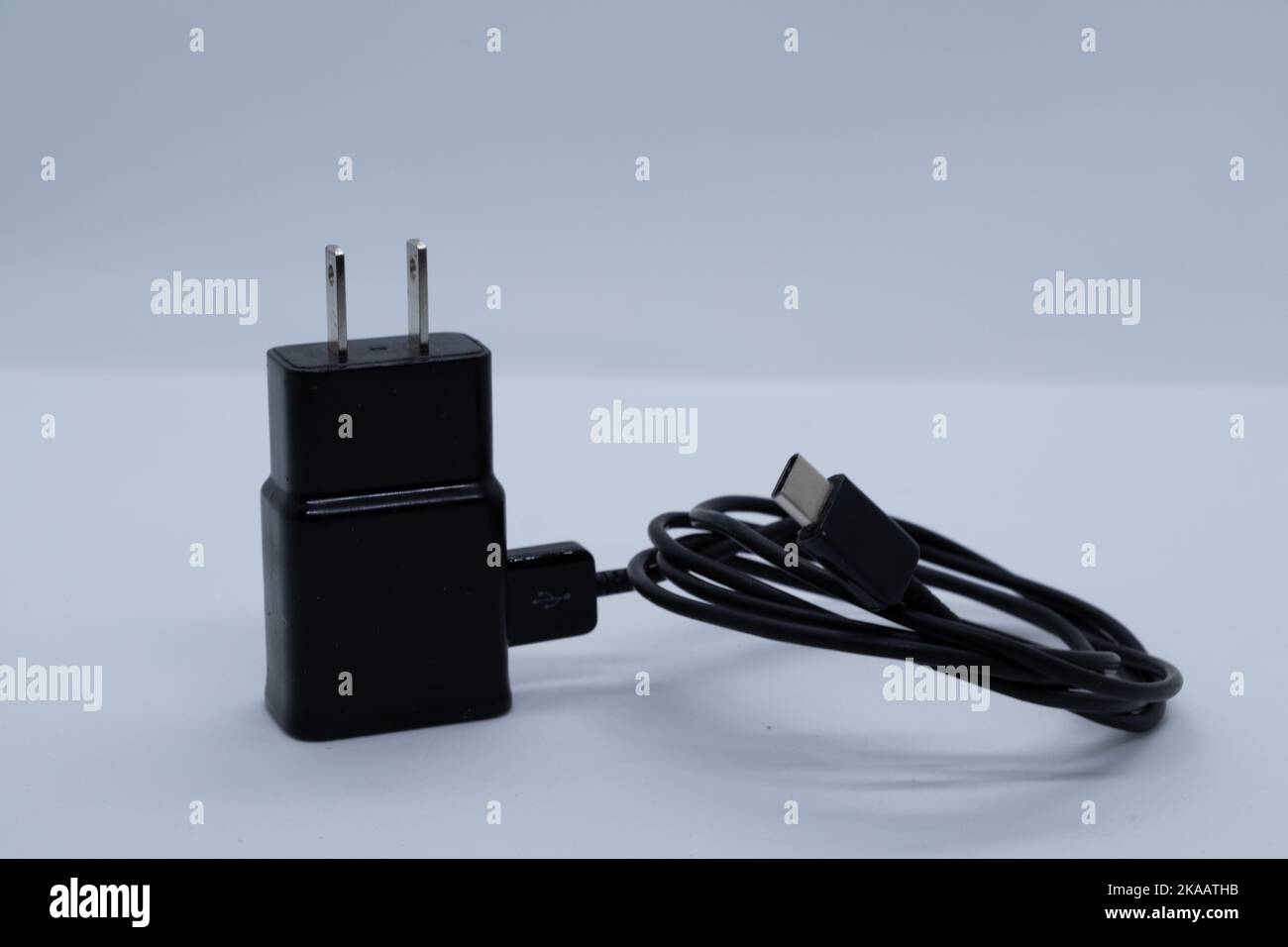 Black charger and cable on white background Stock Photo