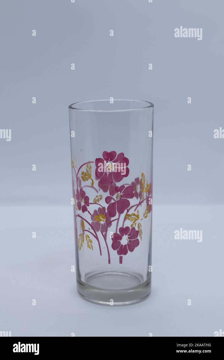 Glass cups with flower image on white background Stock Photo Alamy