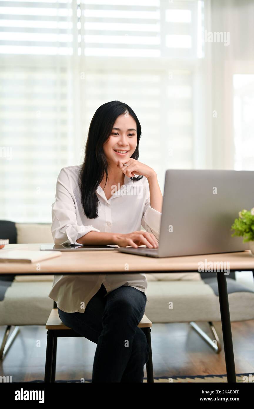 Portrait, Charming and beautiful young Asian businesswoman or female ...