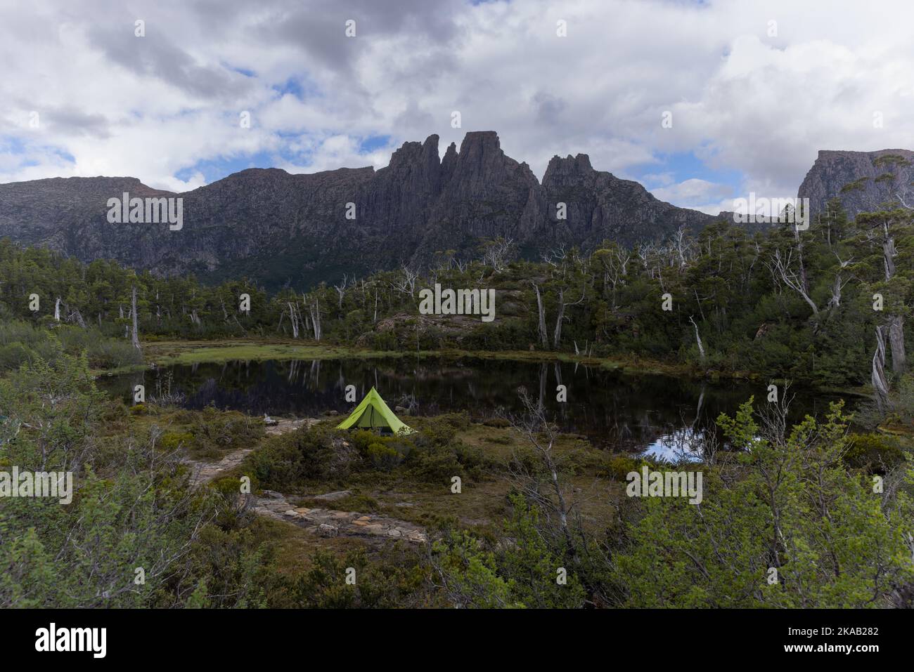 a tent pitched at pool of memories with mt geryon in the distance Stock Photo