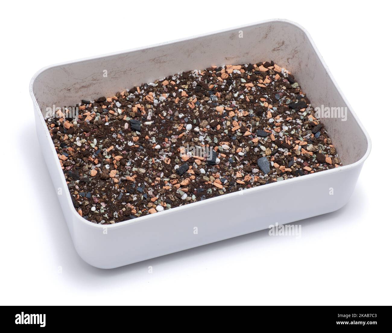plastic box with substrate soil for transplanting houseplants isolated ...