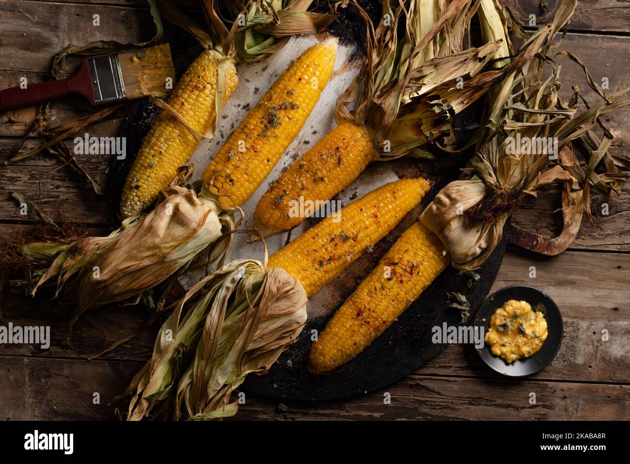 roasted corn with husks Stock Photo Alamy