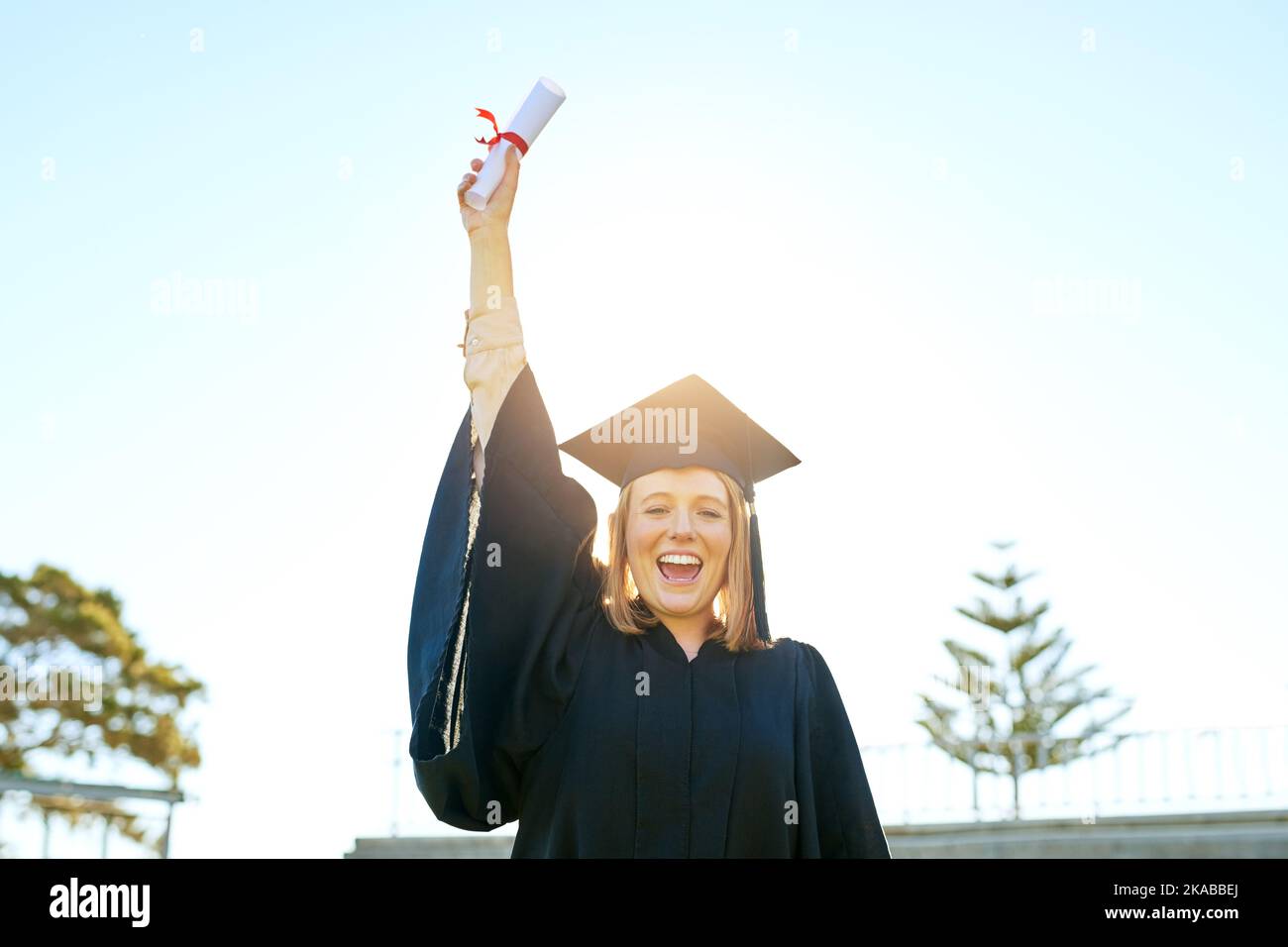 See what believing in yourself can do. Portrait of a student holding ...