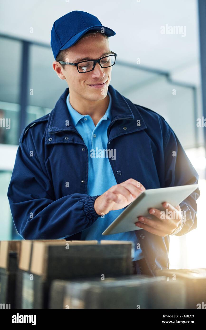 Working with a paperless system for added efficiency. a courier using a