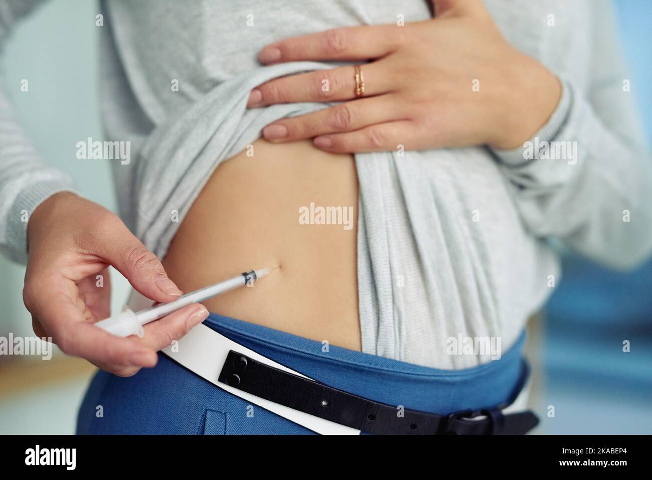 Taking her insulin shot. Closeup shot of an unidentifiable