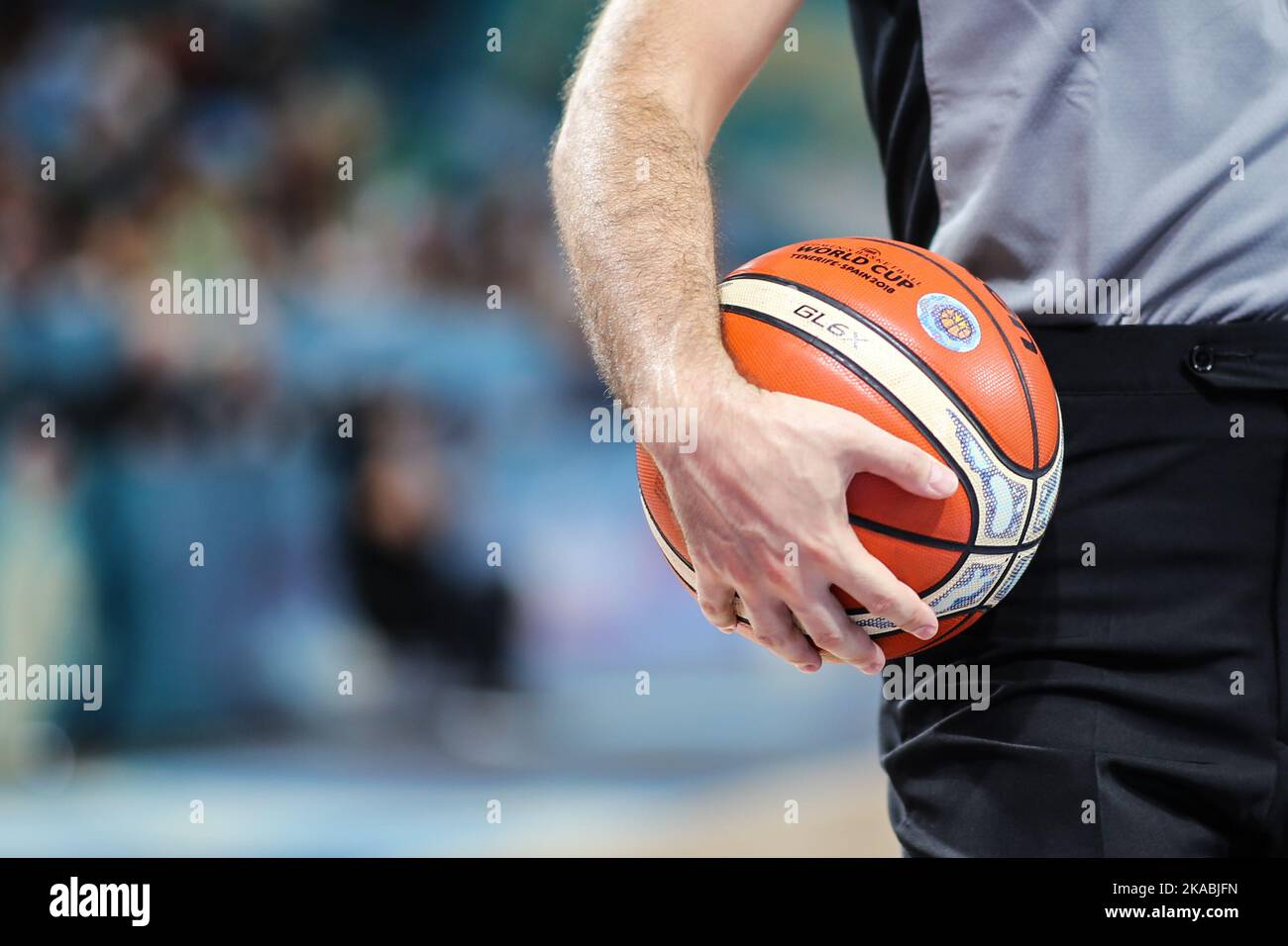 Spain, Tenerife, September 23, 2018: male referee holds the ball during the FIBA Women's Basketball World Cup Stock Photo