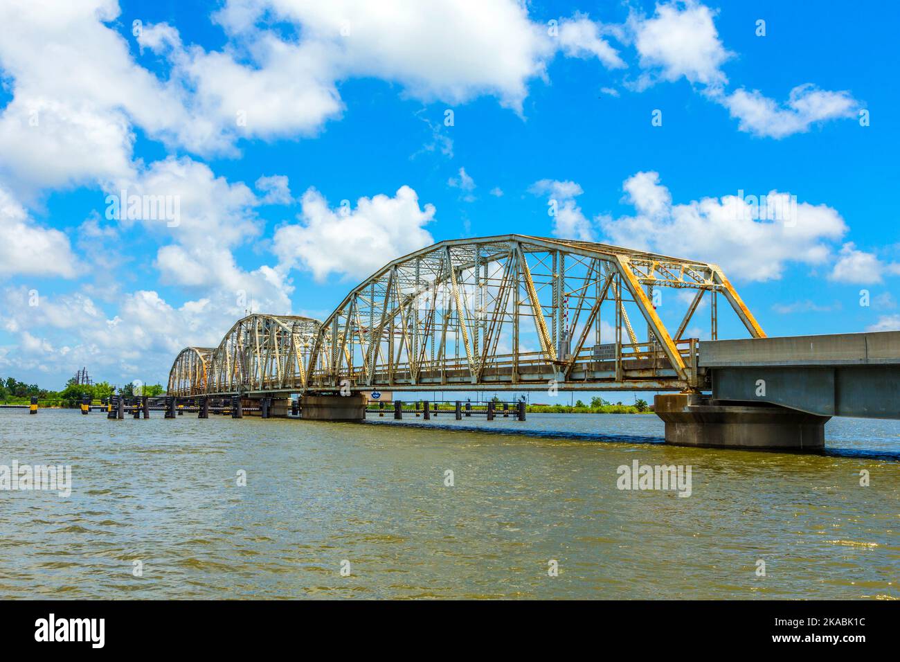 driving on Chef Menteur Highway with old bridge in East area of New