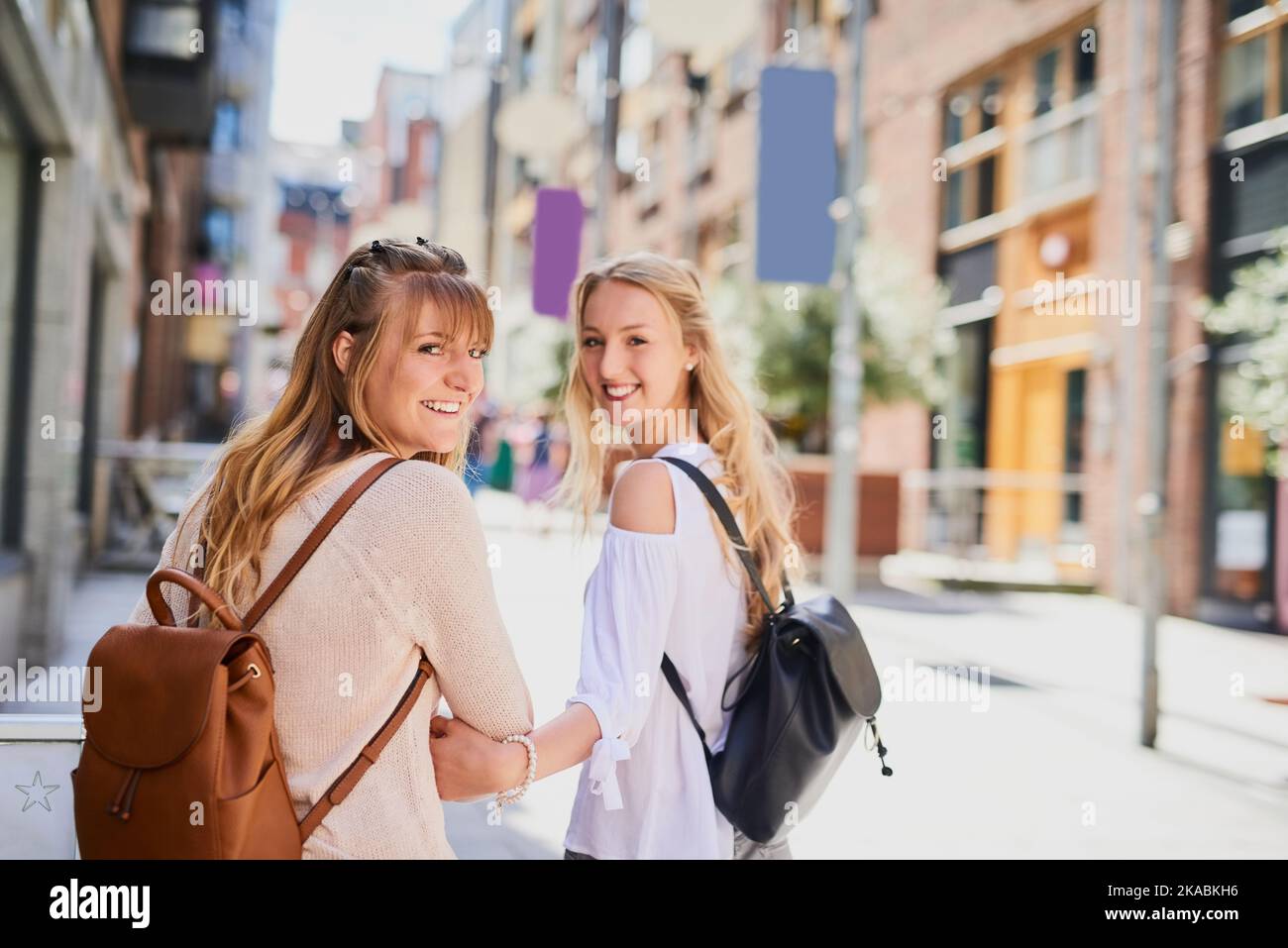 We love travelling. Rearview portrait of two attractive young girlfriends exploring a foreign city. Stock Photo