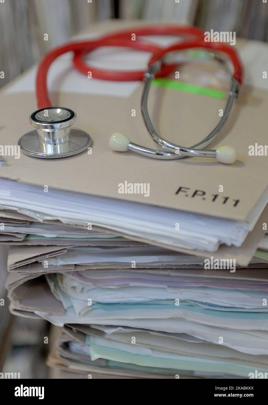 File photo dated 10/09/14 of a stethoscope on top of patient's files. Concerns have been raised about high levels of transphobia and homophobia that UK doctors are facing at work. The British Medical Association said that the LGBTQ+ medical workforce can face 'derogatory language, social exclusion and having their professional competence doubted'. Stock Photo