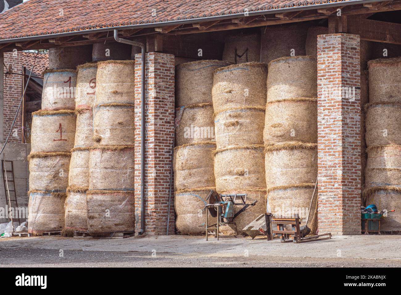 Hay bales storage in a farm building. Intensive animal farming or