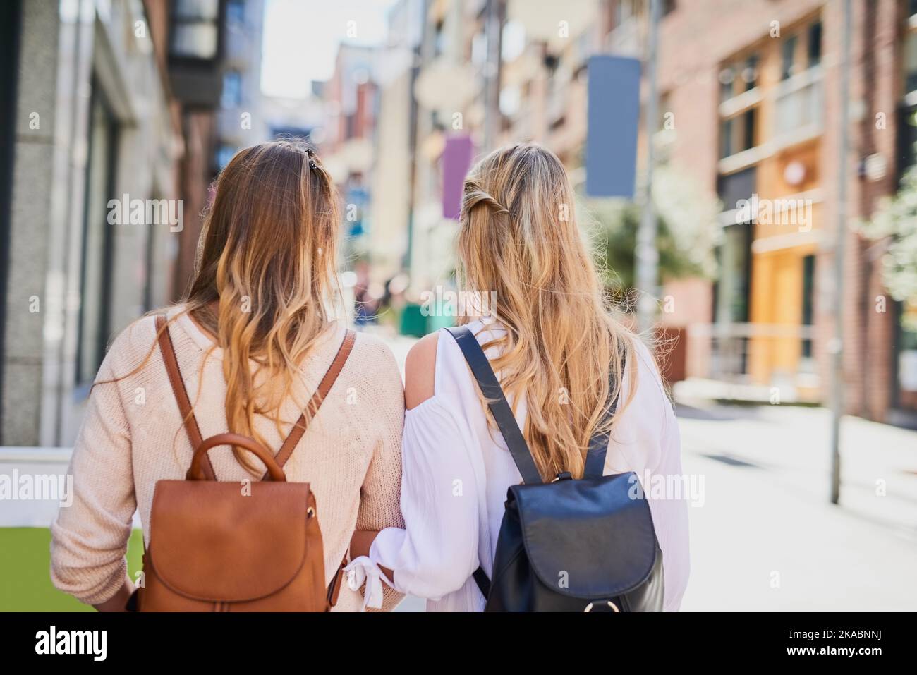 Seeing the world. Rearview shot of two unrecognizable young girlfriends exploring a foreign city. Stock Photo
