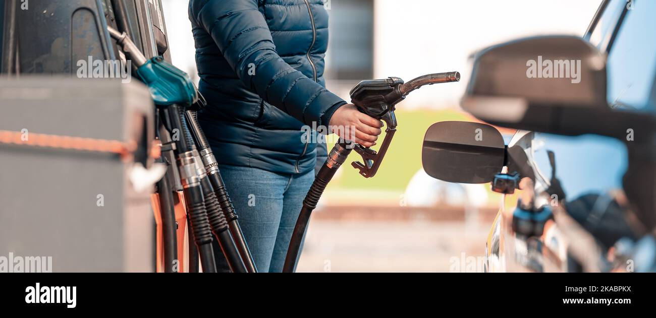High prices of petrol and diesel fuel ath the petrol station, young