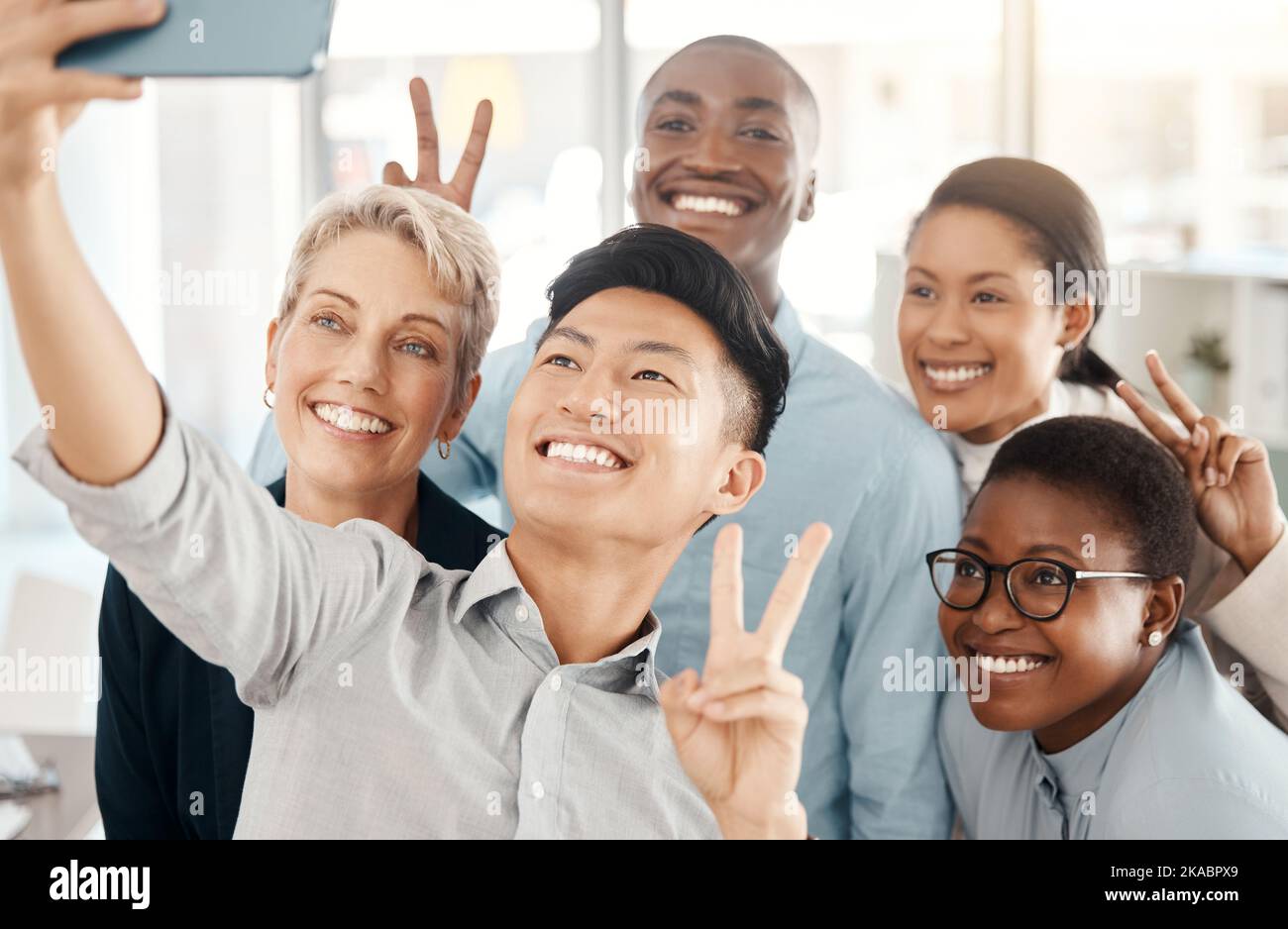 Team selfie, support and diversity with business people in office, community in workplace and teamwork picture. Partnership, solidarity and working Stock Photo