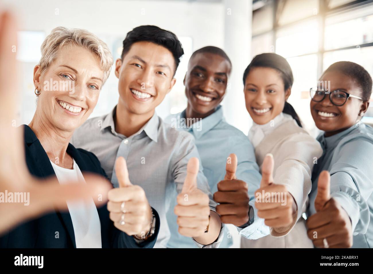 Thumbs up, thank you and happy business team with positive energy for ...