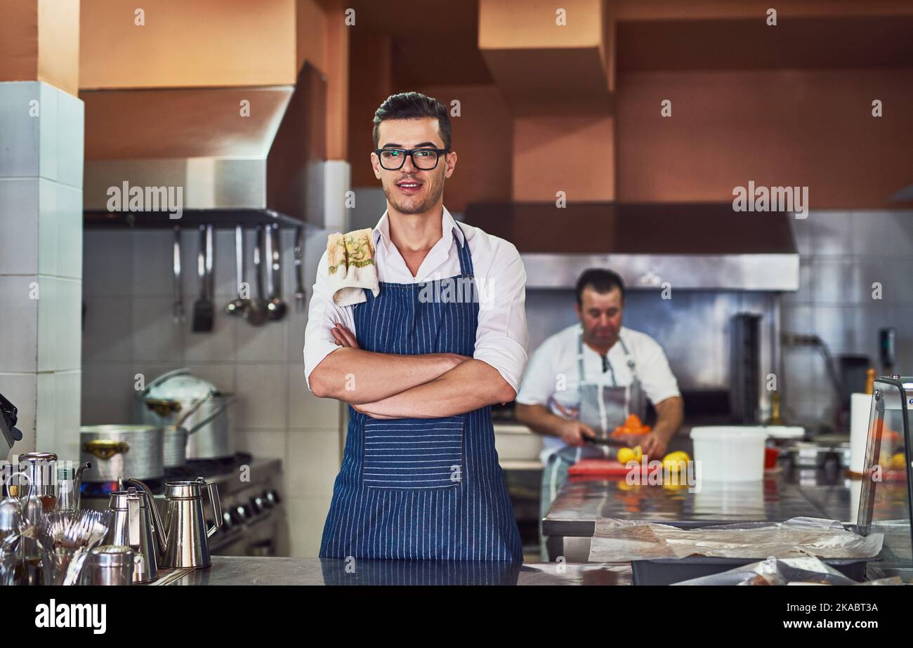 The hardest workers in the industry. men working at a restaurant. Stock Photo