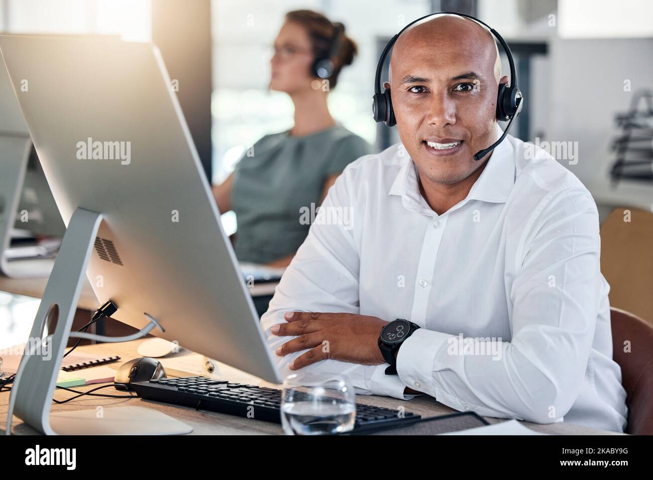 Portrait, black man and call center for customer support, computer and headset for consulting, talking and in office. Telemarketing, consultant and Stock Photo