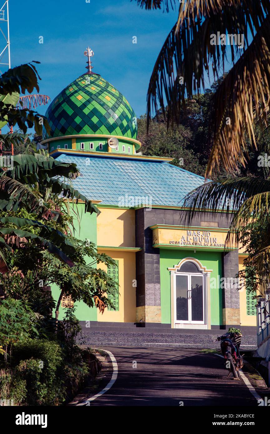 Indonesian colorful muslim Mosque under palm trees in Aku de Gual or Suak Gual, in Belitung archipelago. Stock Photo