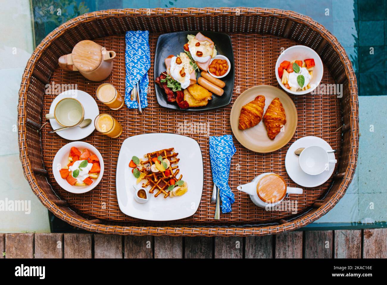 Flat lay or top view shot of a wooden floating breakfast tray contains
