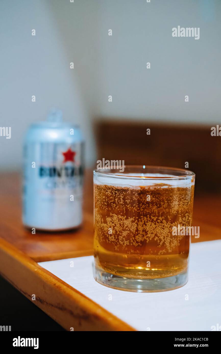 A glass of beer that produced by Indonesian beer maker company with blurred background Stock Photo