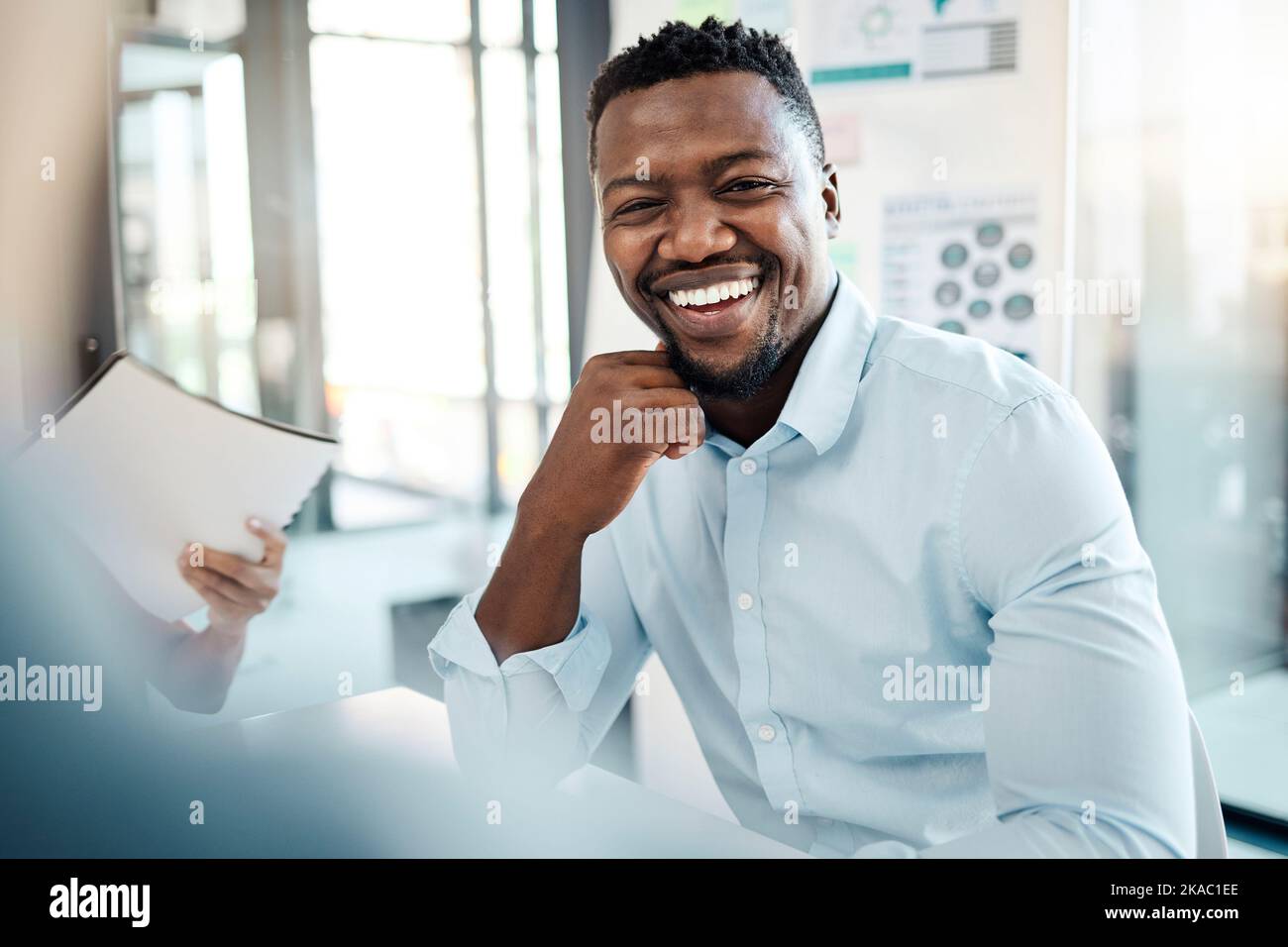 Black business man, employee and smile of a office worker listening to a presentation. Portrait of a happy startup entrepreneur in a b2b strategy Stock Photo