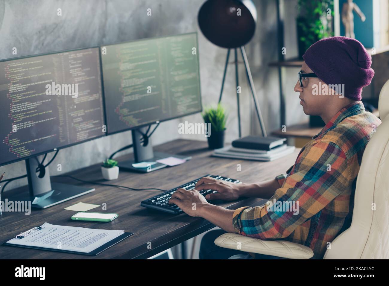 Photo of serious confident guy dressed eyewear hat typing code modern ...
