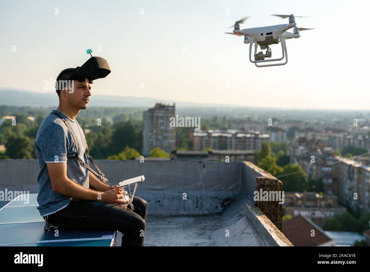 Man with drone flying at the city Stock Photo