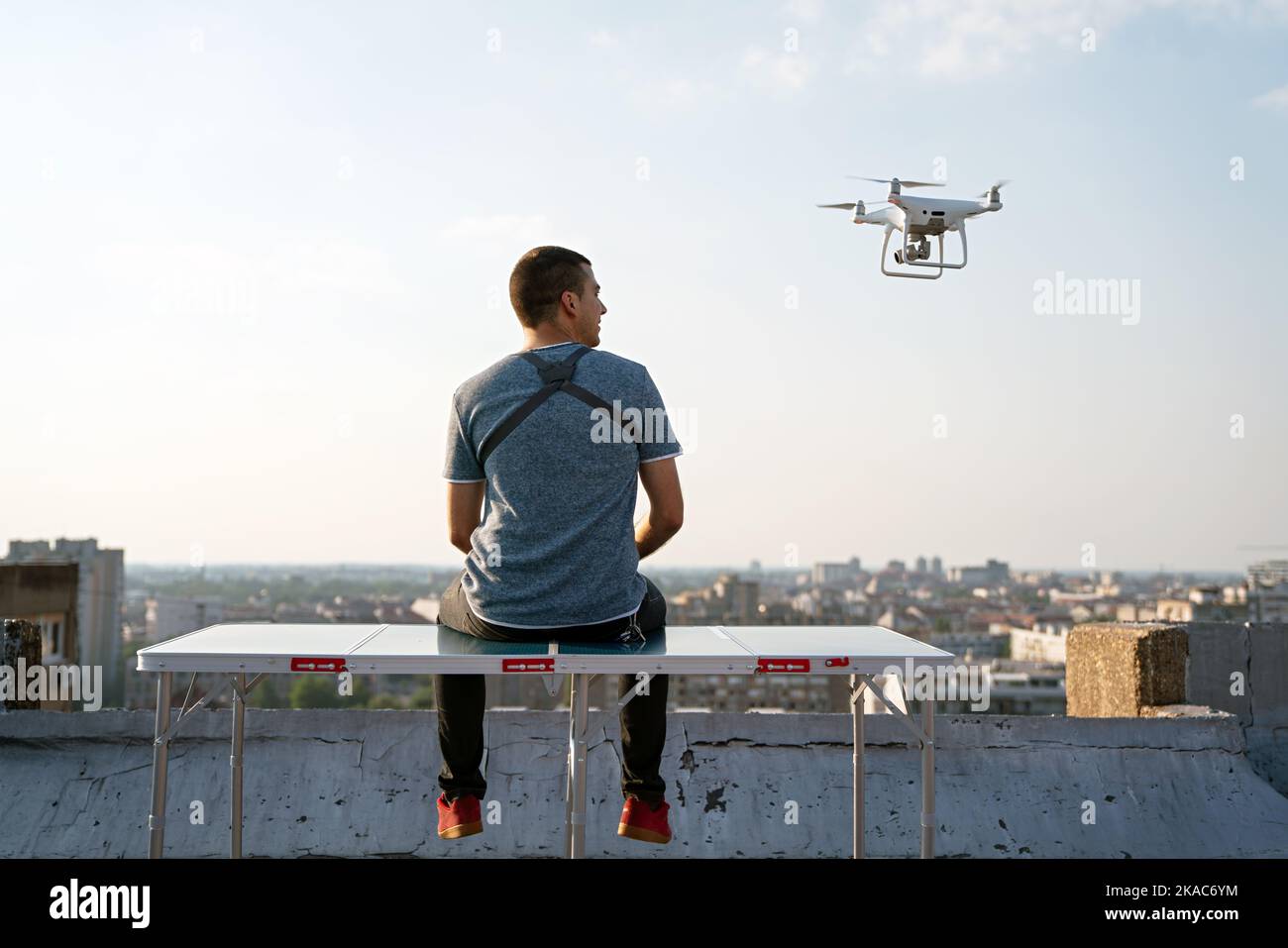 Man with drone flying at the city Stock Photo