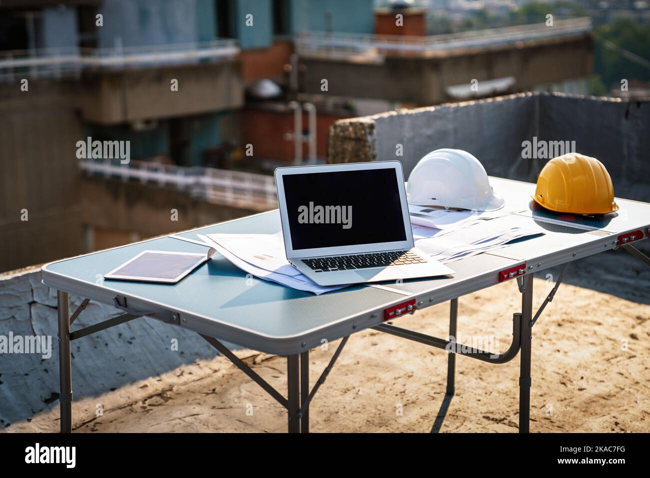 Concept of architects, engineer equipment on the desk with a blueprint in construction site