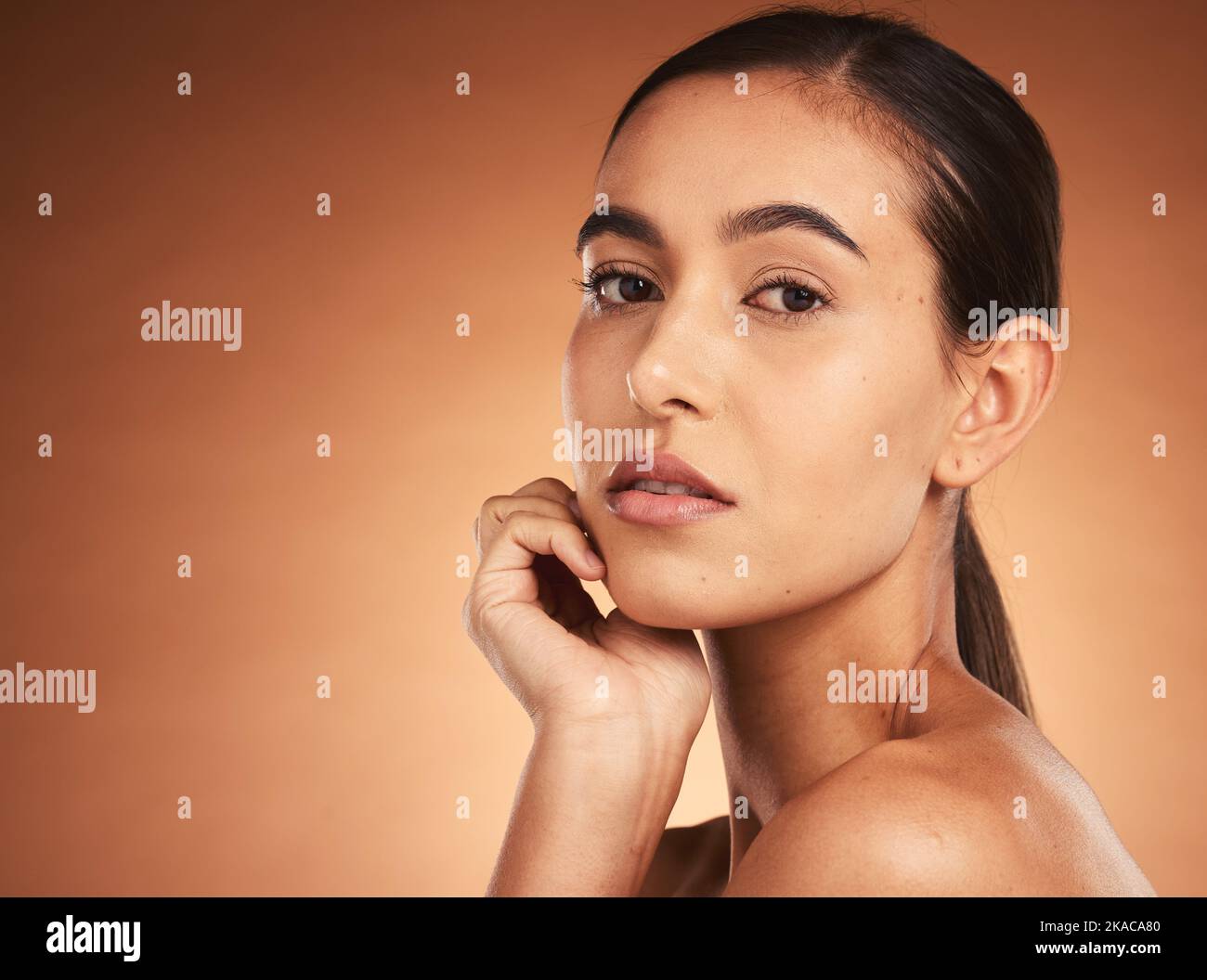 Beauty, makeup and face portrait of woman on brown studio background