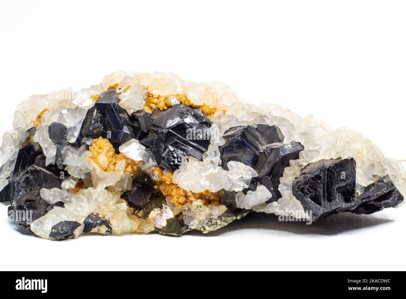 A crystal and stone cluster with clear white quartz, silver metallic pyrite and black matrix macro close up isolated on a white Stock Photo