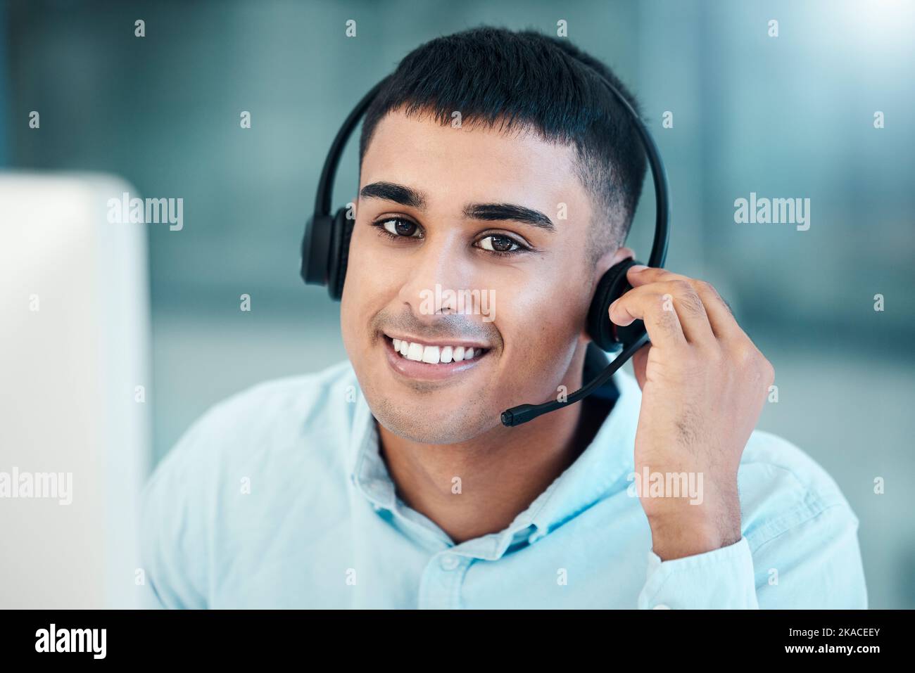 Call center, communication and face of worker working in telemarketing, online support and crm business with a pc. Customer service, consulting and Stock Photo