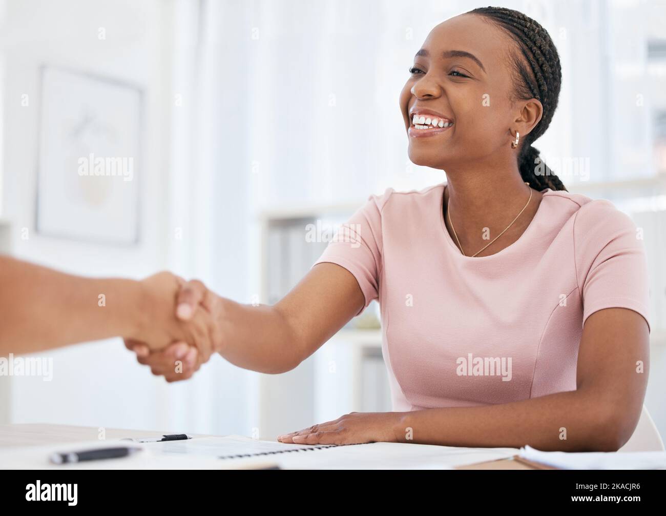 Business, black woman and handshake, deal and HR hiring in meeting, interview and consulting, support and teamwork success. Happy employee shaking Stock Photo