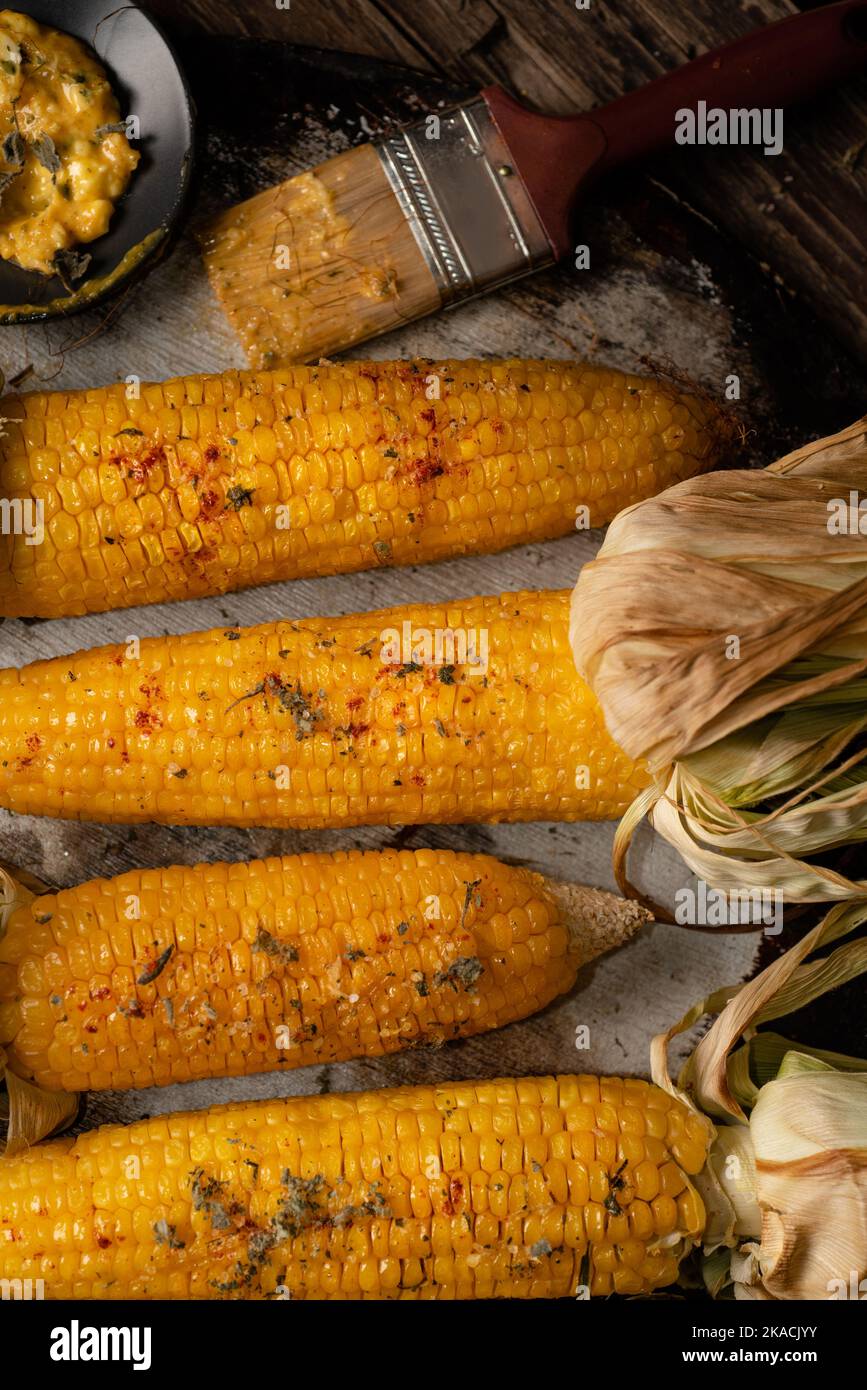 roasted corn with husks Stock Photo Alamy