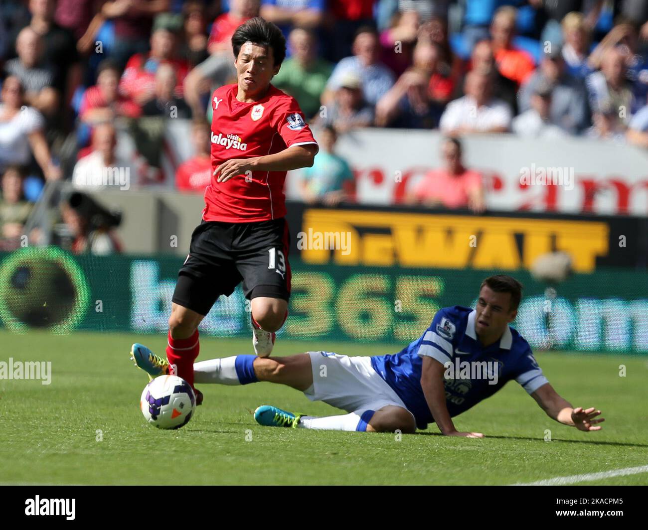 31st August 2013- Barclays Premiership - Cardiff City Vs Everton -  Kim Bo-Kyung of Cardiff City is fouled by Seamus Coleman of Everton - Photo: Paul Roberts/Pathos. Stock Photo