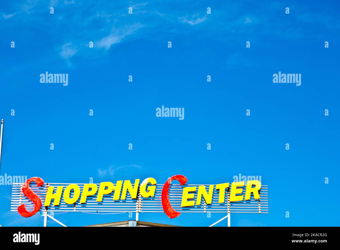 shopping center sign with blue sky Stock Photo - Alamy