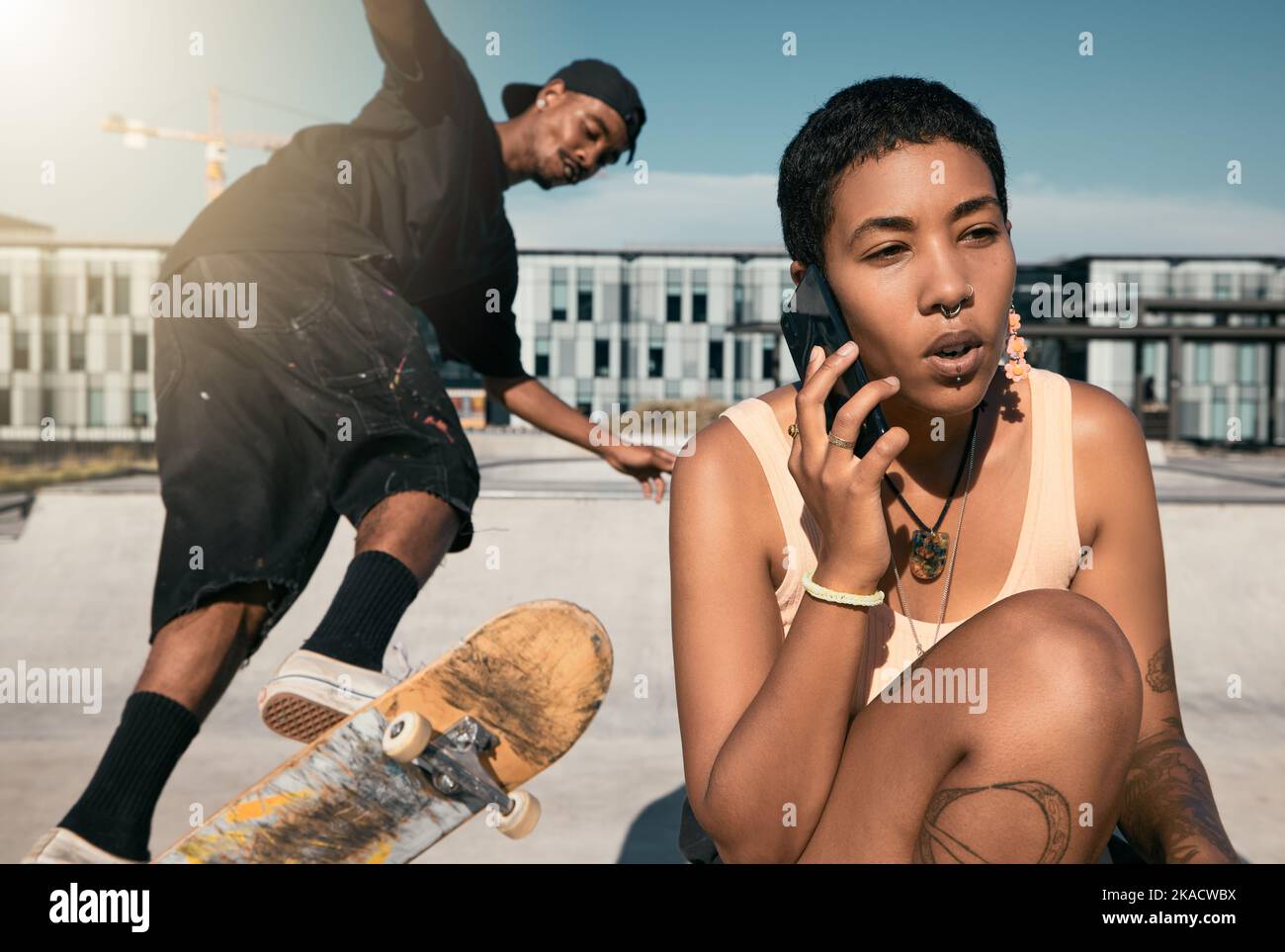 Skateboard, summer and phone call with friends at urban city hangout in sunshine together. Skater people at recreation facility for outdoor activity Stock Photo