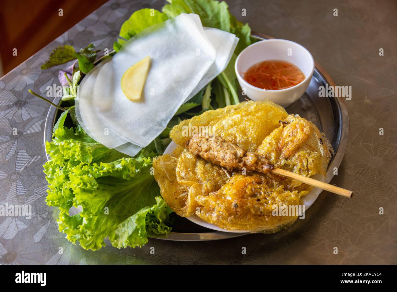Banh xeo and nem lui at Banh Xeo Sau Phuoc restaurant, Hanoi, Vietnam Stock Photo